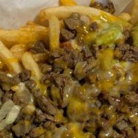 Carne Asada Fries · French fries topped with carne asada, guacamole cheese, and sour cream.