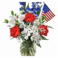 Red White Blue Arrangement · variety of seasonal flowers in red white and blue and greenery designed by florist with a fl...