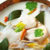 Tom Kha Noodle Soup · Coconut base hot & sour soup with mushrooms, onion, lemongrass, lime leaves, rice noodles, c...