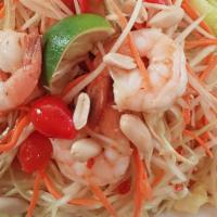 Som Tum (Papaya Salad) · Spicy. Choice of tofu or prawns with garlic, papaya, tomato, carrots, peanuts, and palm sugar.