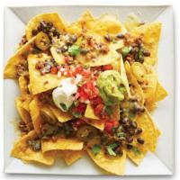 Loaded Nachos · Chips, shredded cheese or yellow queso, refried, black, or pinto beans, choice of protein, p...