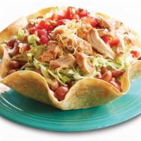 Taco Salad · Baked tortilla shell, refried, black, or pinto beans, choice of protein, lettuce, cheese, so...