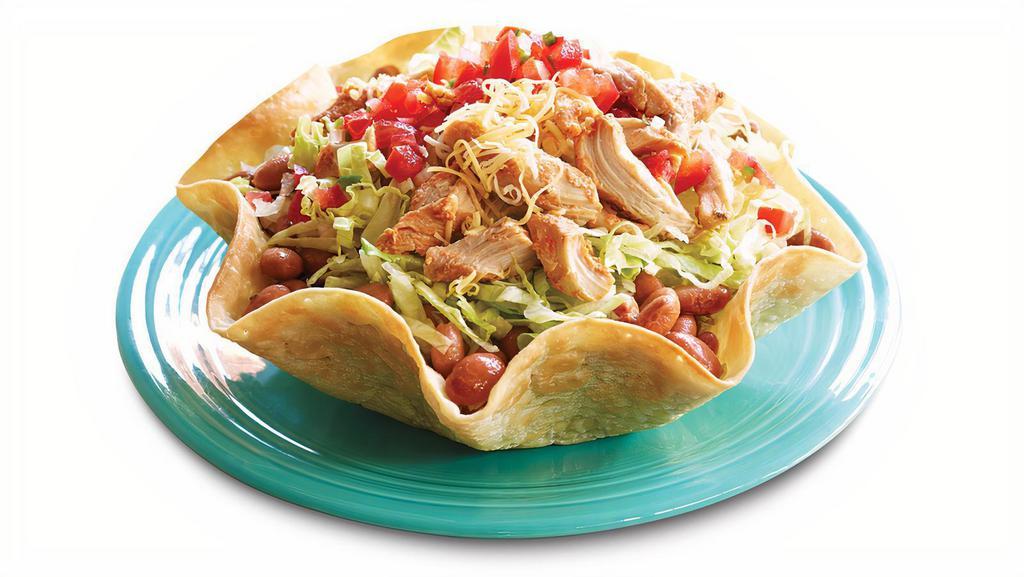 Baja Taco Salad · Baked Tortilla shell, beans, lettuce, meat, cheese and pico de gallo.