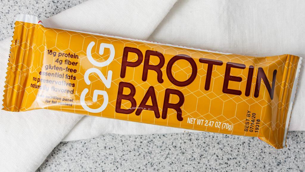 G2G  Protein Bar Peanut Butter Banana Chocolate · G2G  Protein Bar Peanut Butter Banana Chocolate!  With 18grams of Isolate Whey Protein and 4G of Fiber. Gluten Free and packed with Essential Fats. Made in the USA with no preservatives and pressed fresher and refrigerated for ultimate freshness and taste!