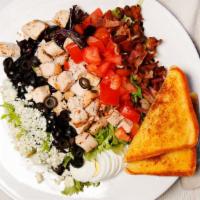Cobb · Grilled chicken, Bleu cheese crumbles, bacon, hard-boiled eggs, tomato and black olives over...