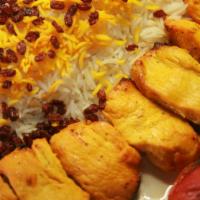 Zereshk Polow · Saffron steamed basmati rice topped with roasted barberries served with chicken kabob.