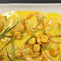 Lobster Ravioli · Ravioli stuffed with shrimp and lobster, sauteed with julienne zucchini in a light saffron s...