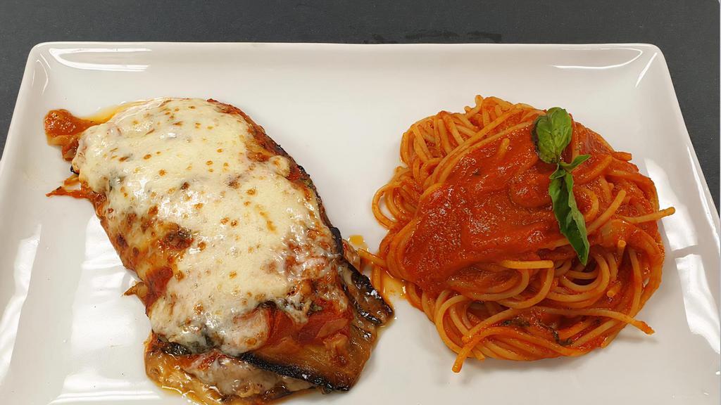 Eggplant Parmigiana · Vegetarian. Tomatoes, mozzarella cheese and fresh oregano, served with spaghetti pasta in a marinara sauce.