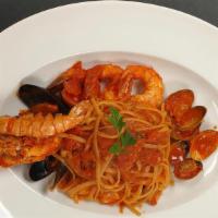 Seafood Linguine · Mediterranean black mussels, clams, shrimp,  scallops,  served with cherry tomato sauce.