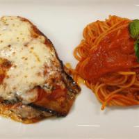 Eggplant Parmigiana · Tomatoes, mozzarella cheese and fresh oregano, served with spaghetti pasta in a marinara sau...