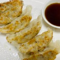 Gyoza (6) · pork dumplings, sesame soy vinaigrette.