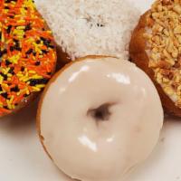 White Iced Cake Donut · sprinkles, nuts, coconut, iced