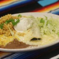 Spinach Enchiladas · Two stuffed corn tortillas filled with spinach, monterey jack cheese, topped with creamy whi...