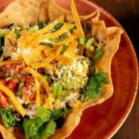 Taco Salad · Your choice of chicken, beef, or beans, served with guacamole, sour creme, pico de gallo, an...