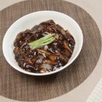 Wok'N Guys Jjajang Myun · Homemade noodles, shrimp, squid, and vegetables cooked in a chili oil jjajang sauce.