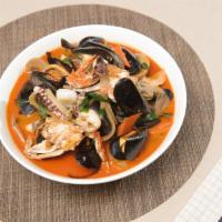 Seafood Jjambong · Spicy. Crab, shrimp, squid, mussels, clams vegetables, and our homemade noodles prepared in ...