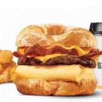 Double Croissan'Wich With Sausage Bacon Egg & Cheese Combo · Made with a 100% butter for a soft, flaky croissant piled high with fluffy eggs, two helping...
