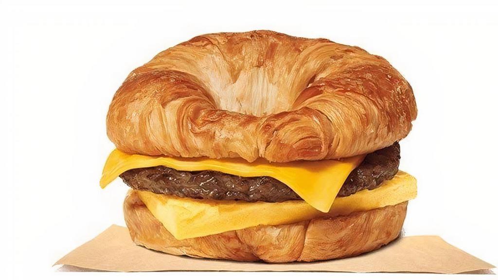 Sausage Egg & Cheese Croissan'Wich · Our grab-and-go Sausage, Egg & Cheese CROISSAN’WICH®is now made with 100% butter for a soft, flaky croissant piled high with savory sizzling sausage, fluffy eggs, and melted American cheese.