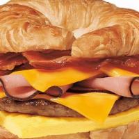 Loaded Croissan'Wich With Sausage Bacon Ham Egg & Cheese · Our Fully Loaded CROISSAN’WICH® Sandwich is now made with 100% butter for a soft, flaky croi...