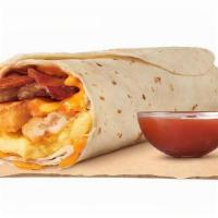 Eggnormous Burrito With Sausage Bacon Egg & Cheese · Featuring a generous serving of savory sausage, thick-cut smoked bacon, lots of fluffy eggs,...