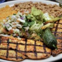 Pollo Asado · Marinated chicken breast cooked over charcoal. Served with guacamole. served with rice and w...