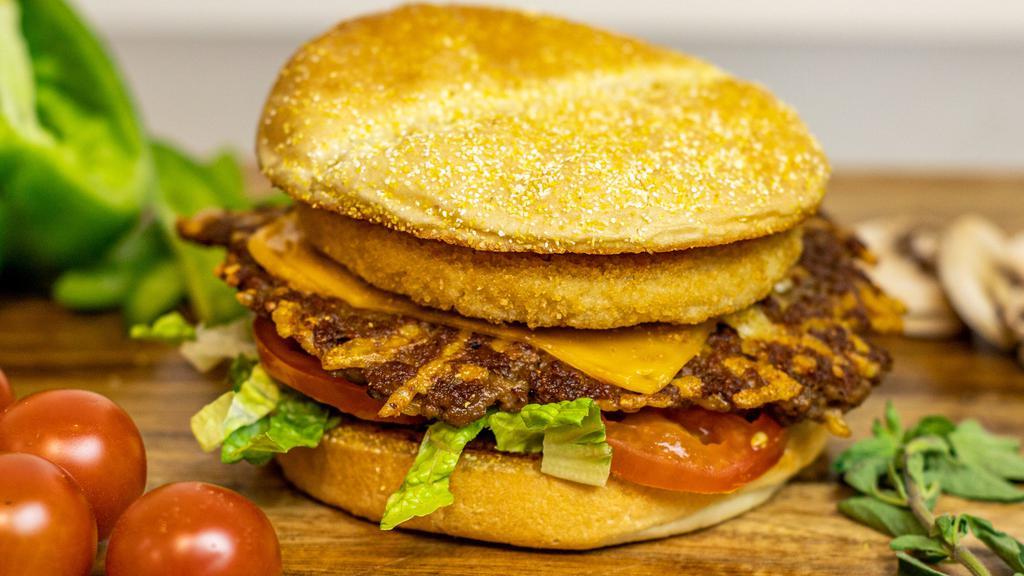 House Burger · Unique combination of one vegan chicken patty and one vegan burger patty topped with vegan cheddar cheese on a toasted bun with your choice of toppings.