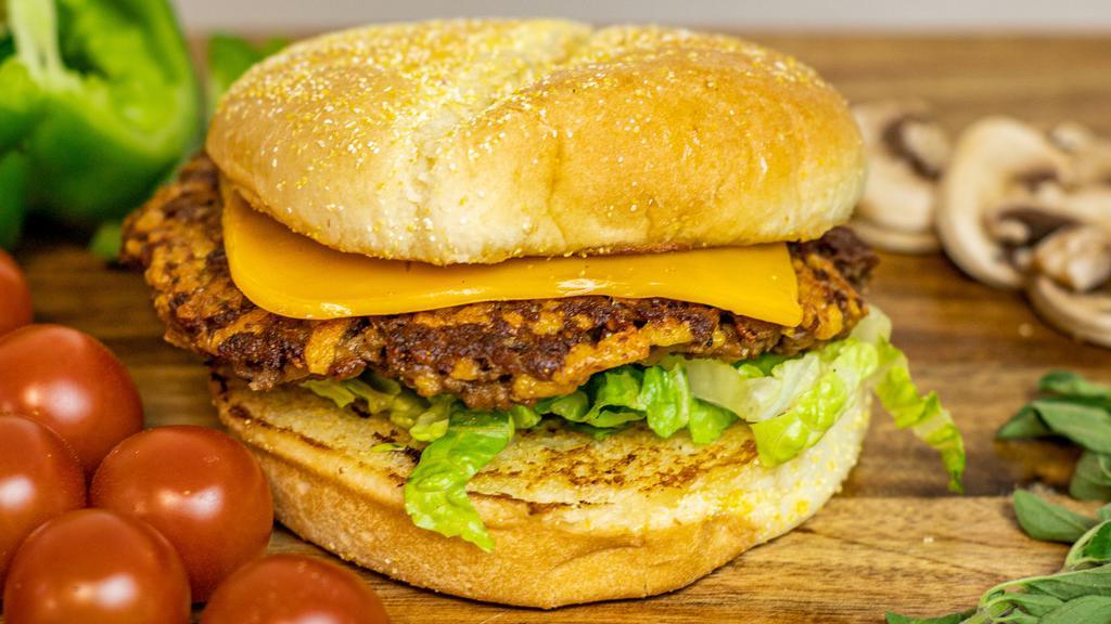 Inside Out Cheese Burger · Plant based patty infused with shredded vegan cheddar cheese and topped with vegan cheddar cheese on a toasted bun with your choice of toppings.
