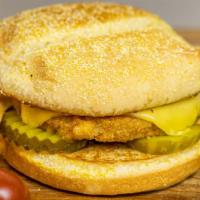 Vegan Chicken Burger · Plant based chicken patty topped with vegan gouda cheese on a toasted bun with your choice o...