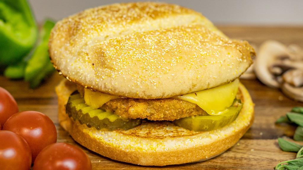 Vegan Chicken Burger · Plant based chicken patty topped with vegan gouda cheese on a toasted bun with your choice of toppings.