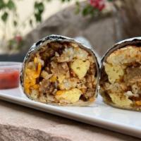 Vegan Breakfast Burrito · Warm tortilla filled with vegan eggs, sausage, tator tots, country gravy and melted cheese. ...