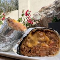 House Burrito · Warm tortilla filled with vegan beef, refried beans, pico de gallo and melted vegan cheese. ...