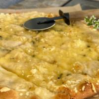 12” Garlic Bread With Melted Vegan Mozzarella · Topping includes vegan butter with fresh garlic, herbs and vegan mozzarella.
