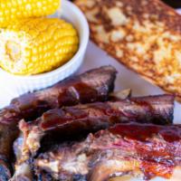 (3) Prime Beef Ribs And Texas Toast · Comes with one side item and barbeque sauce.