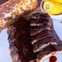 Dinner #4: 1/2 Slab Baby Back Ribs · Served with your choice of two side orders and Texas toast