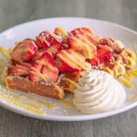 Liege Waffles With Fresh Strawberries And Lemon Curd · Our wonderful Liege waffles with homemade Lemon Curd and real whipped cream.