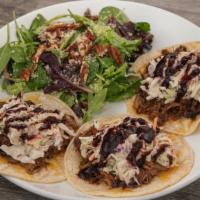 Blackberry Ancho Pulled Pork Tacos · Corn Tortilla, Jack and Cheddar Cheese, House made Slaw and House Smoked Pulled Pork with Bl...