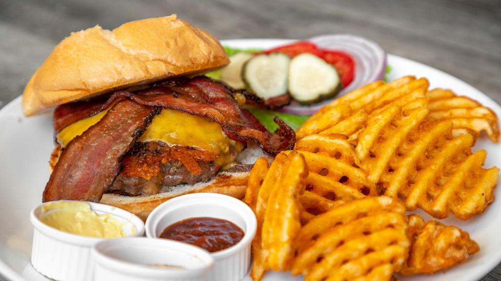 Bacon Cheddar Burger · Bacon, Cheddar and Beef Patty, Topped with Tillamook Cheddar and thick cut pepper bacon.