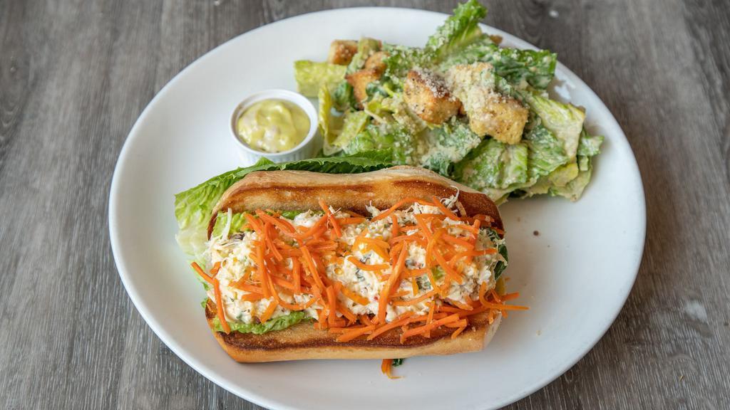 Dungesness Crab Sandwich · Dungeness Crab mixed with basil, Wasabi aioli, pine nuts and sweet peppers, on a roll with lettuce and Ginger Carrots.