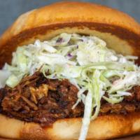 Pulled Pork Sandwich · Pulled Pork with Blackberry ancho BBQ sauce and home made coleslaw. Served with Waffle Fries