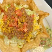 Taco Salad · Deep Fried Flour Shell Filled with Your Choice of Ground Beef, Barbacoa/ Shredded Beef or Sh...