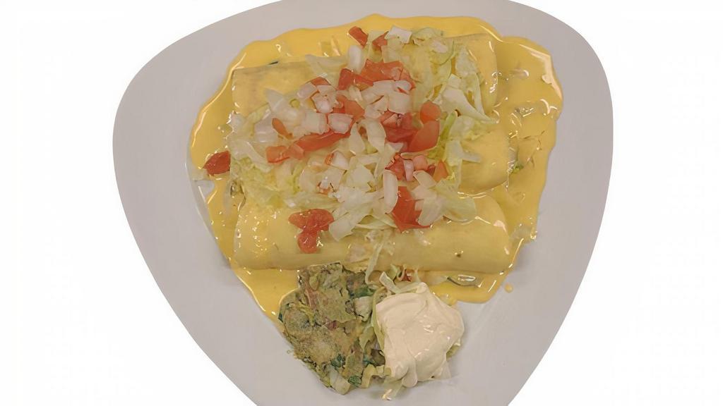 Enchiladas Marias · 4 Corn Tortillas Enchiladas Shredded Beef, Shredded Chicken, Chorizo & Ground Beef, topped with our Home Made Con Queso Sauce (cheese Dip), Lettuce, Tomatoes, Sour Cream and Guacamole