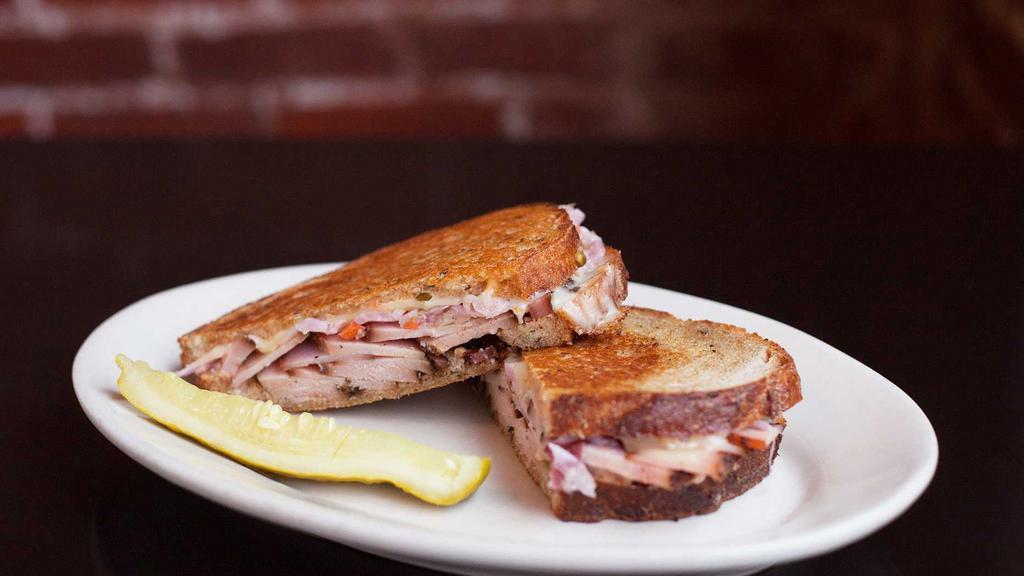 The Rachel · Turkey pastrami with slaw, swiss and Russian.