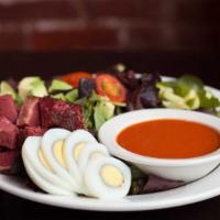 The Big Chopped Salad · Veggies, greens, olives, two kinds of pastrami, hard-boiled egg, avocado, and your choice of...
