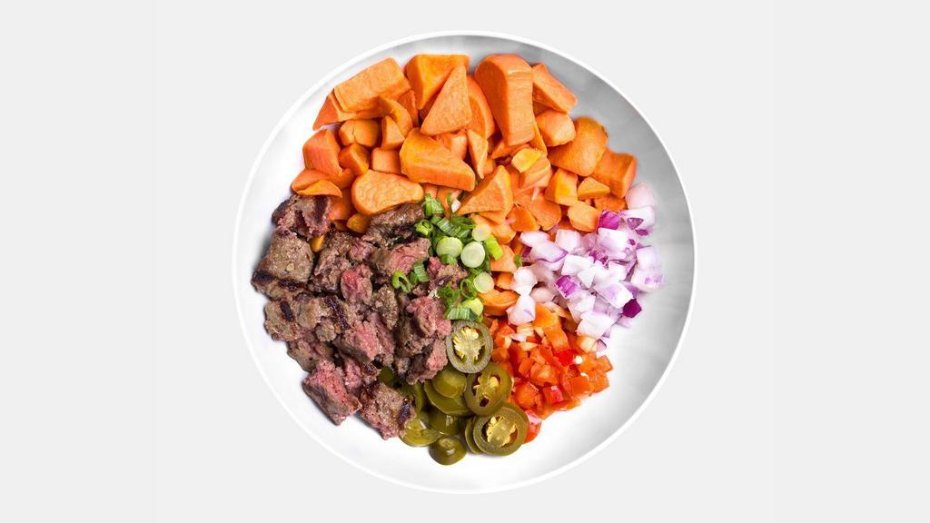 Boss Bowl · 2 Organic Grass-Fed Bison Patties, Grilled Sweet Potatoes, Red Onions, Green Onions, Red Peppers and Jalapenos.