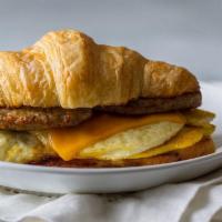 Meat, Egg, And Cheese Breakfast Croissant · Your choice of ham, sausage or bacon with American cheese and two fresh cracked eggs. Served...