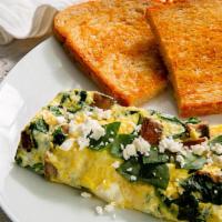 Greek Omelet · 3 ounce scrambled omelet with spinach, feta and portabella mushrooms. Served with toast and ...