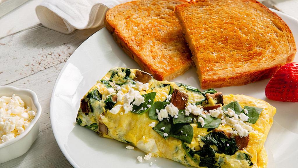 Greek Omelet · 3 ounce scrambled omelet with spinach, feta and portabella mushrooms. Served with toast and a fresh strawberry.