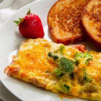 American Omelet · 3 ounce scrambled omelet with ham, cheddar cheese, and broccoli. Served with toast and a fre...