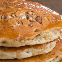 Pecan Pancakes · 3 fluffy pancakes with chopped candied pecans. Served with homemade caramel syrup.
