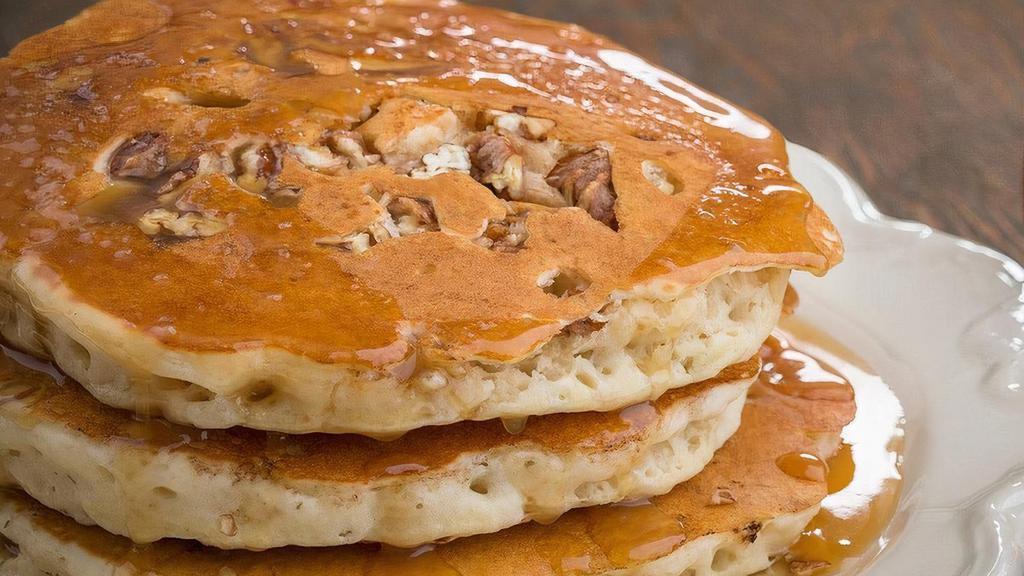 Pecan Pancakes · 3 fluffy pancakes with chopped candied pecans. Served with homemade caramel syrup.